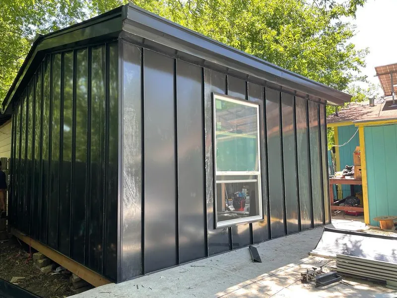 Black standing seam metal wall panels for Roof Inspection in Amherst
