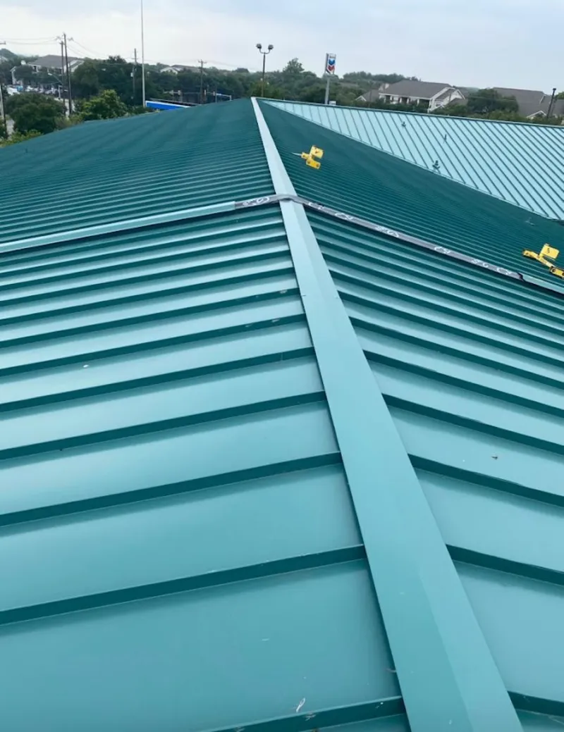 Green commercial metal roof ridge and valley for Metal Roof Repair in Amherst